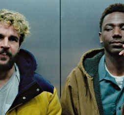Kevin (Christopher Abbott) and Val (Jerrod Carmichael) killing time while in an elevator in 