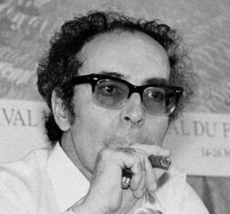 FILE - Film director Jean-Luc Godard smokes at Cannes festival, France on May 25, 1982. Director Jean-Luc Godard, an icon of French New Wave film who revolutionized popular 1960s cinema, has died, according to French media. He was 91. Born into a wealthy French-Swiss family on Dec. 3, 1930, in Paris, the ingenious 